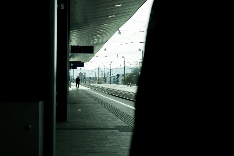 a train passing by on a train track in the dark