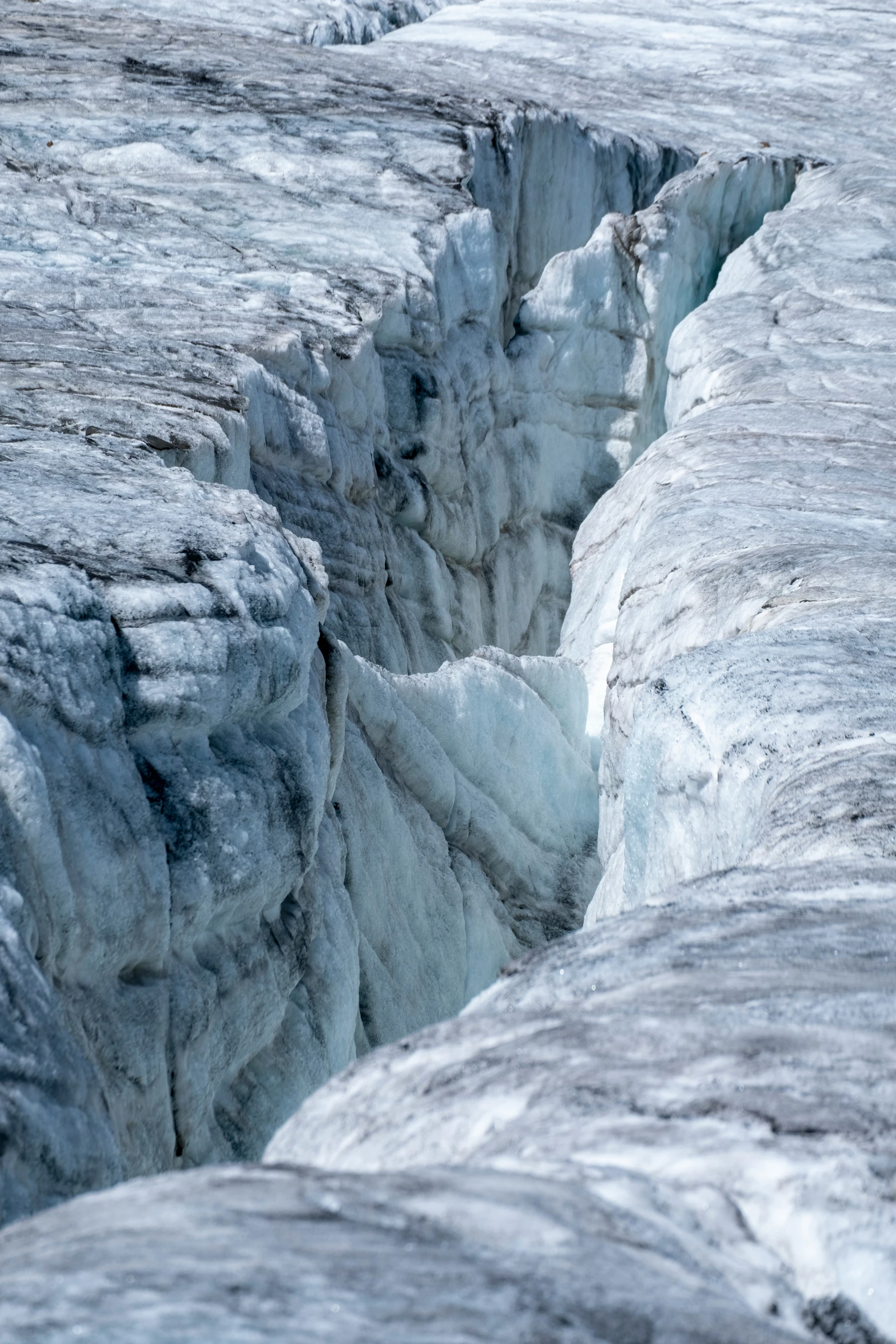 a section of glacier ice with water flowing down it