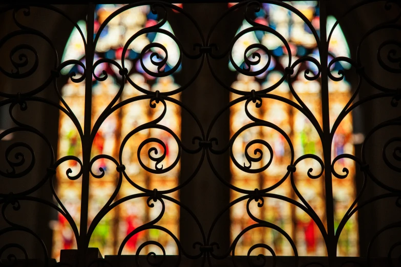 the two stained glass windows have intricate design