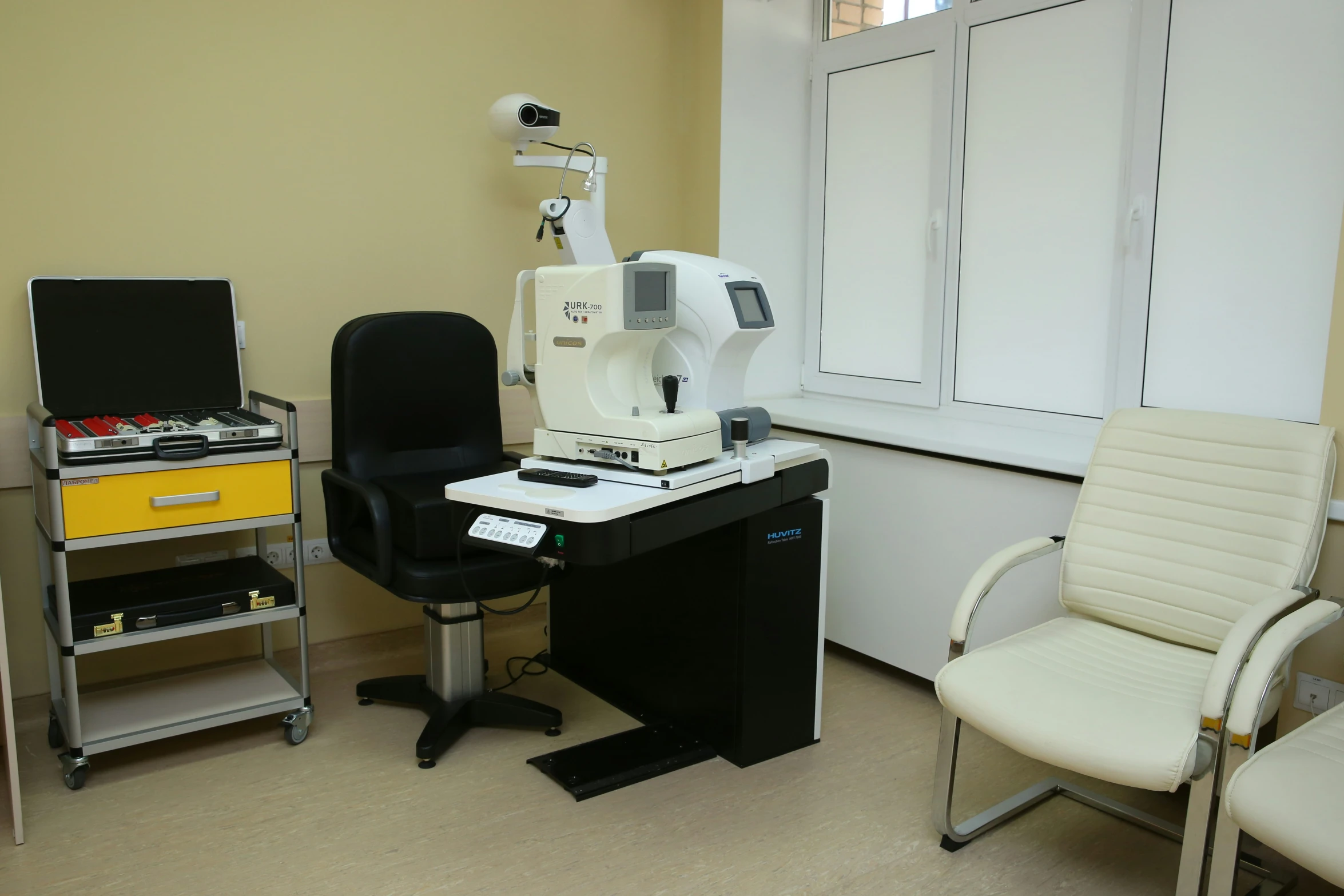 a hospital room with medical equipment on the table