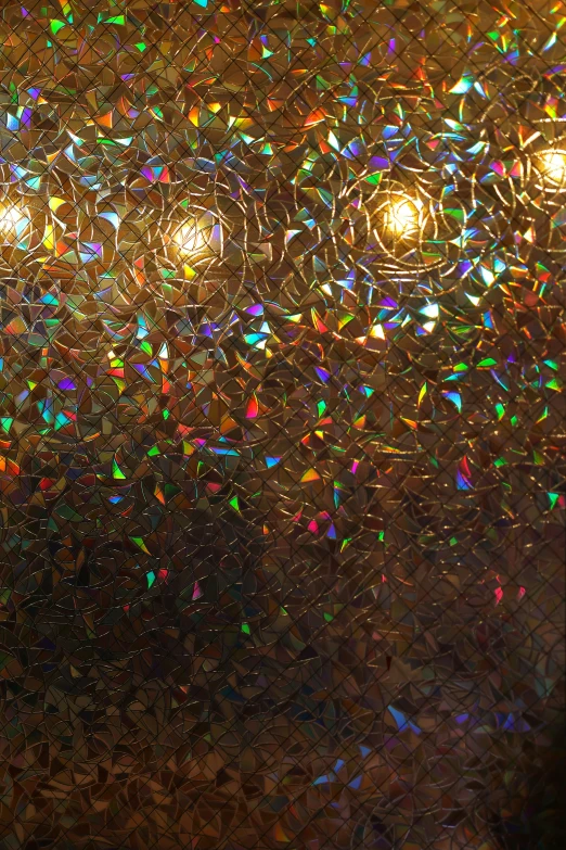 a stained glass window that has several bright lights
