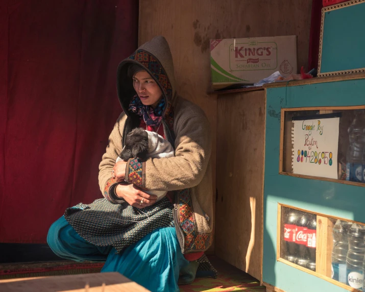 a woman sitting on the floor in a room