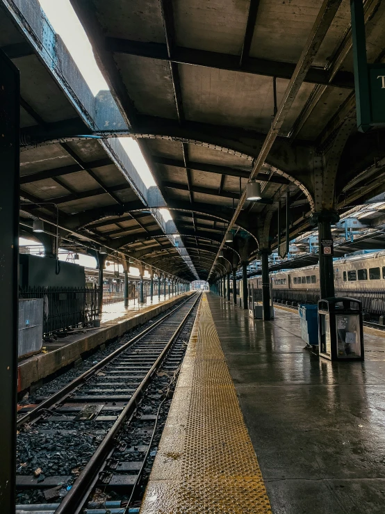 a train sitting in the station in the morning