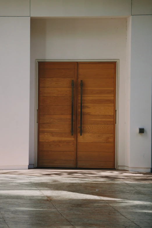 a wooden door of a building with a white background