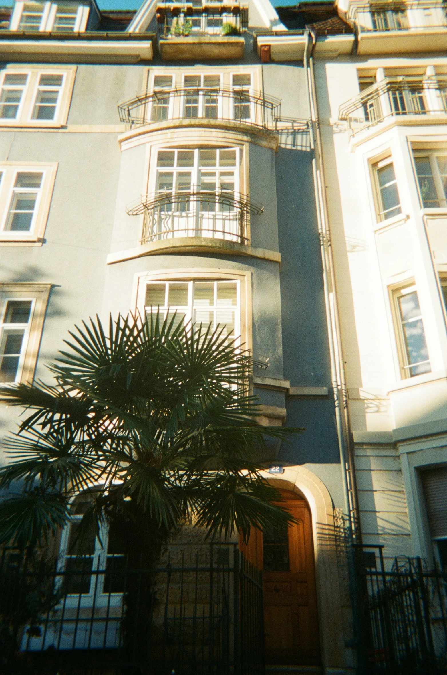 large apartment building with balconies and a balcony