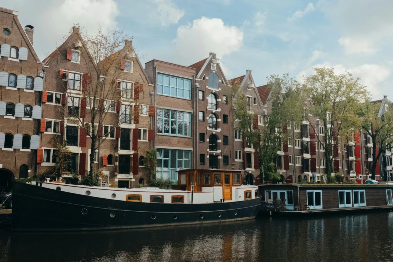 the houseboats are parked in front of the old building