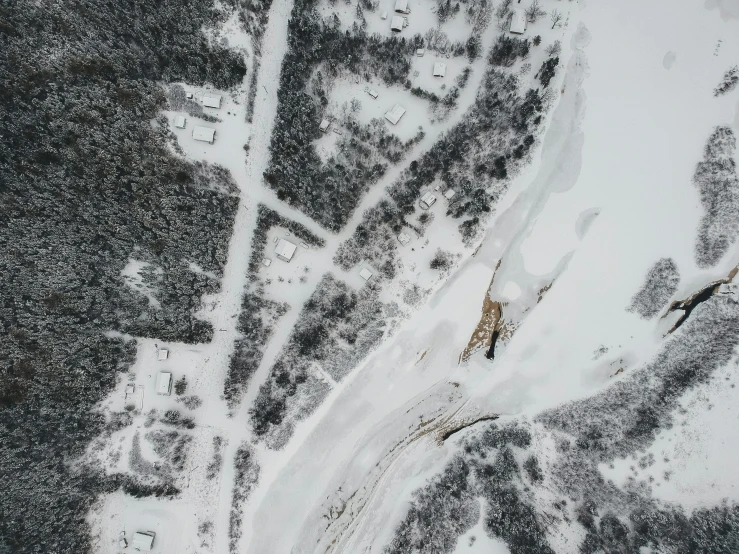 the view from an airplane of snowy hills