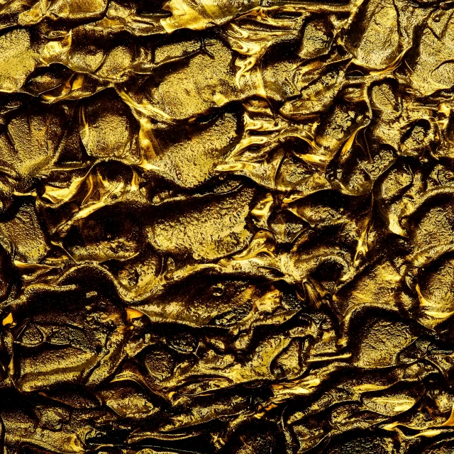 a bunch of dirt with gold leaves on it