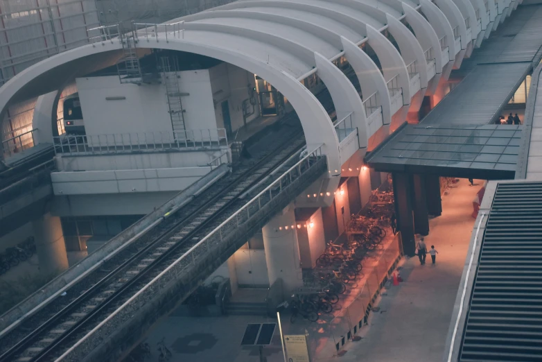 an overhead view of a subway platform at night