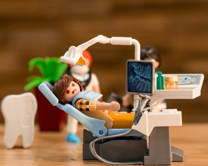 miniature dentist's office with toys on the desk