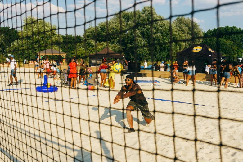 several people playing a game on a sunny day