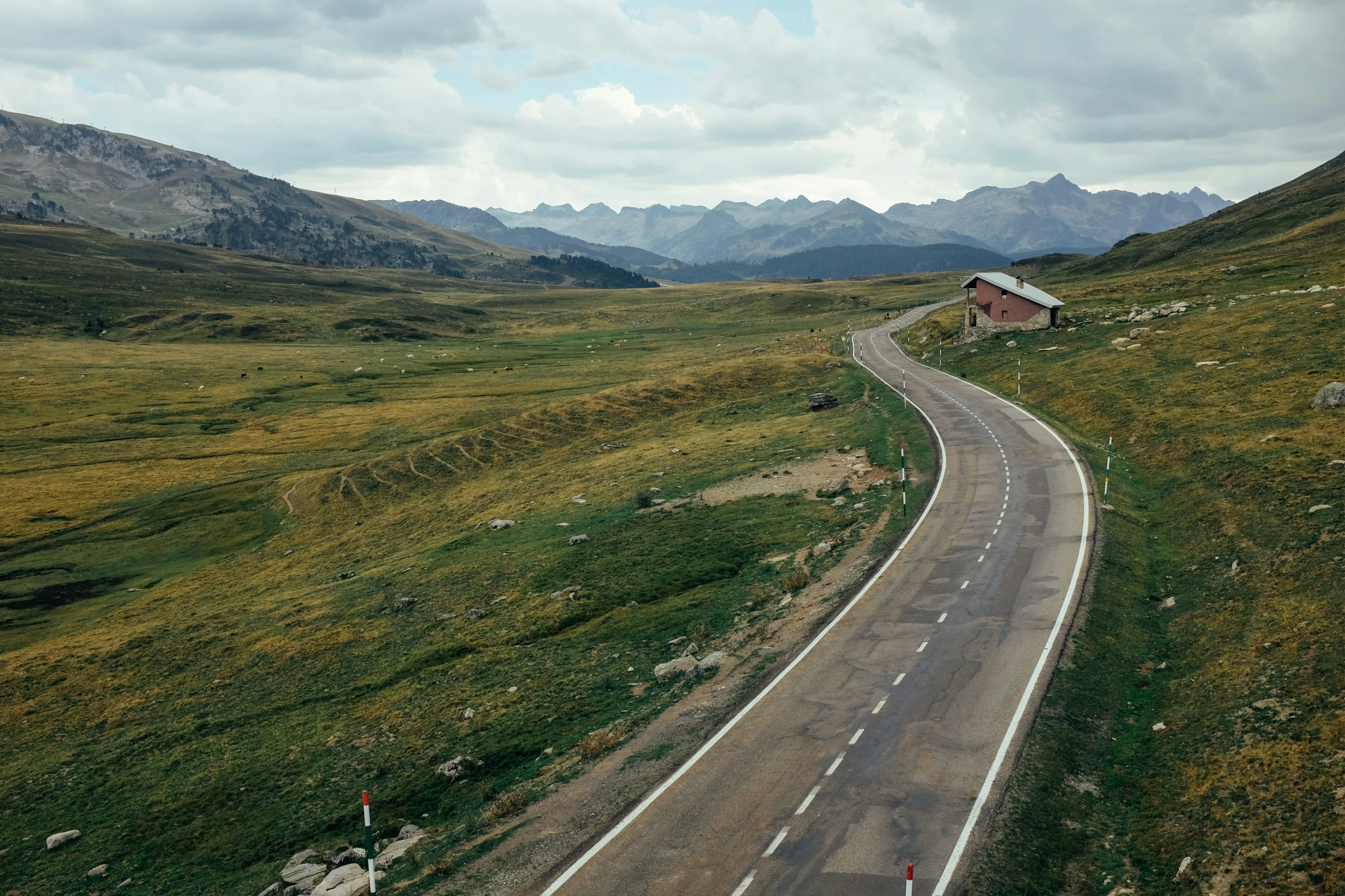 the road is narrow and has no cars on it