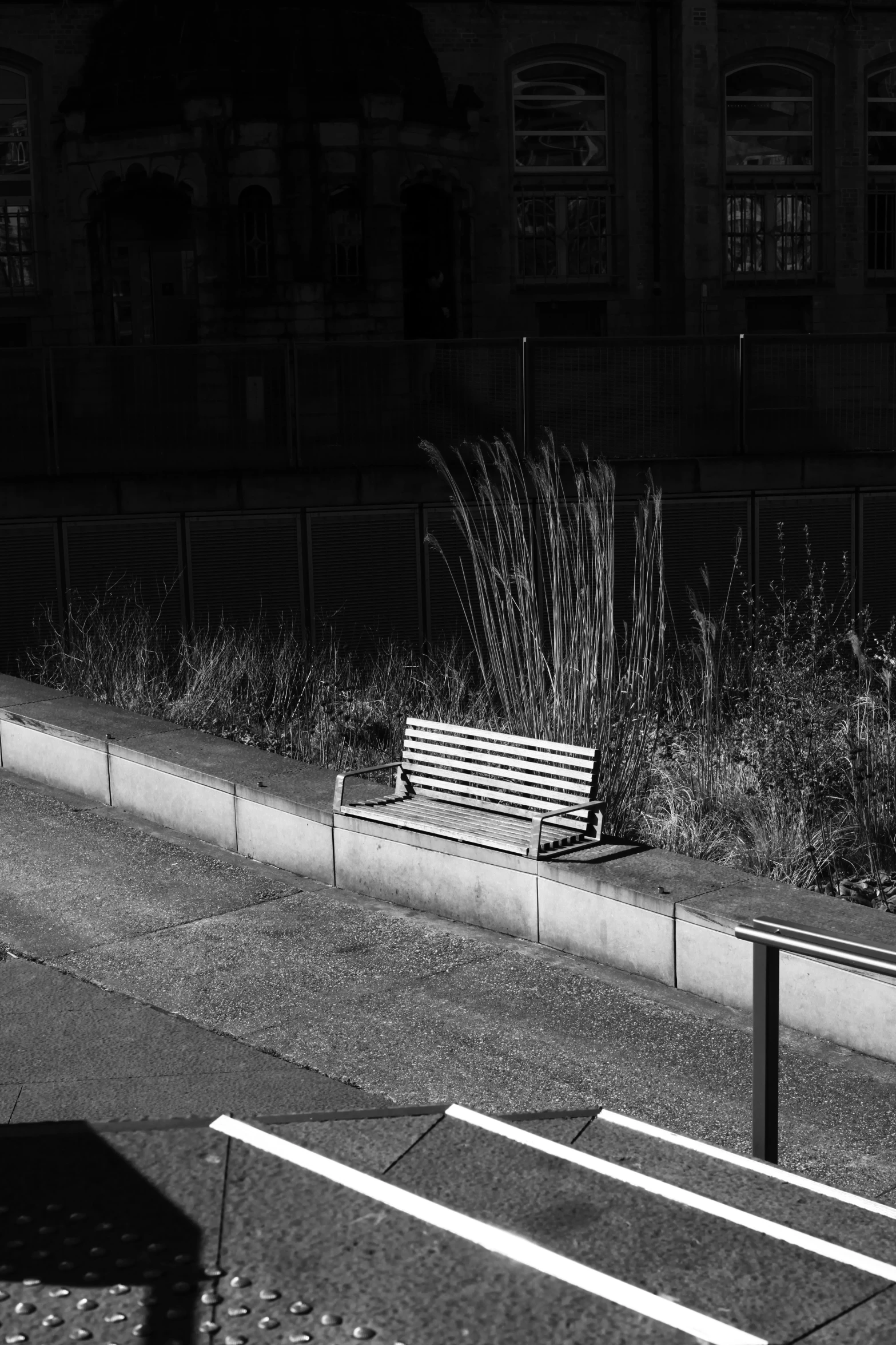 an old bench is near the edge of the road