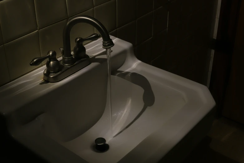 this is a sink with a water spout