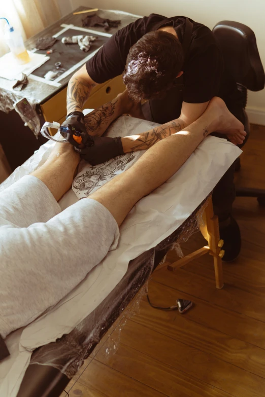 a person with his feet up on a table