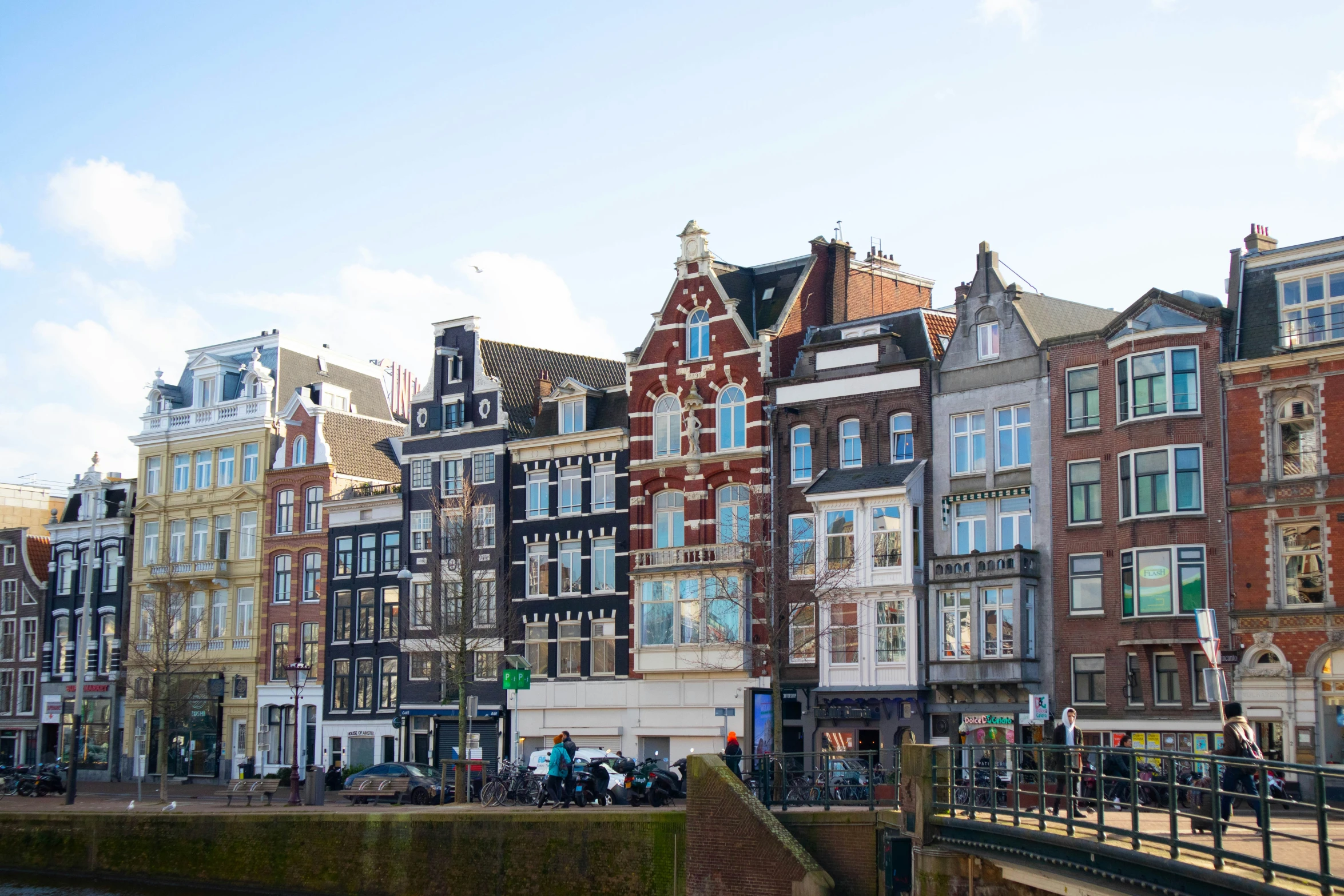 an image of city buildings along the side of a river