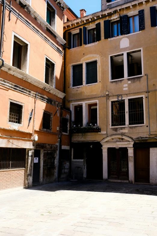 several windows on the back of two buildings