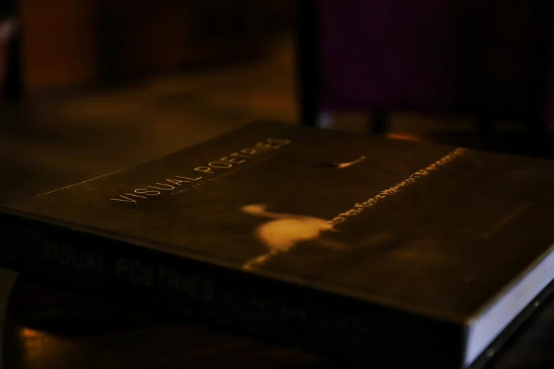 a close up of a book with light reflected on it