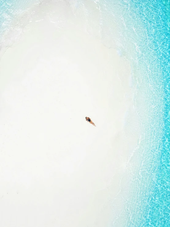 an overhead view of people riding their surfboards in the water