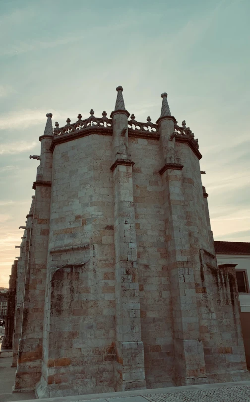 an old, stone tower with gargooms on the top