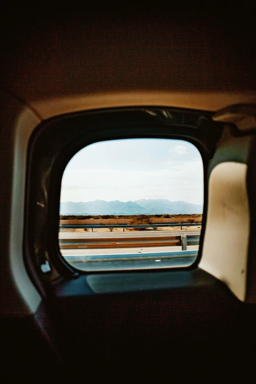 a view of an airplane taken from inside the car