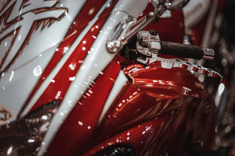 the rear end of a red and white motorcycle