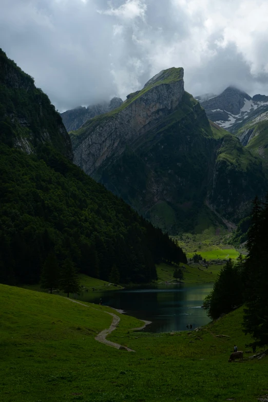 two large mountains stand near the lake