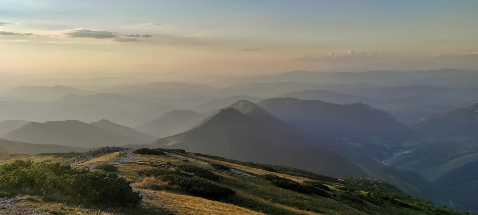 a sheep is standing on a high rocky hill