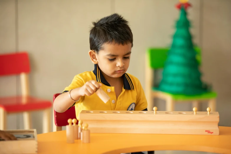 a young child playing with wooden toys in a play room