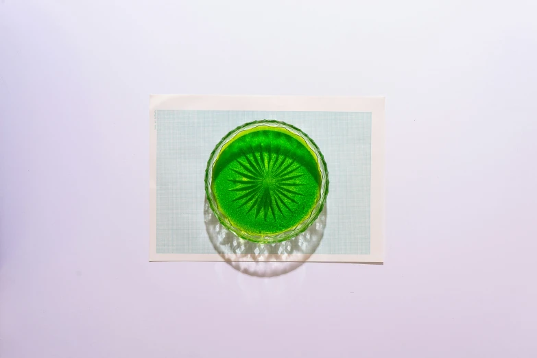 an artistic picture of a green object in a glass