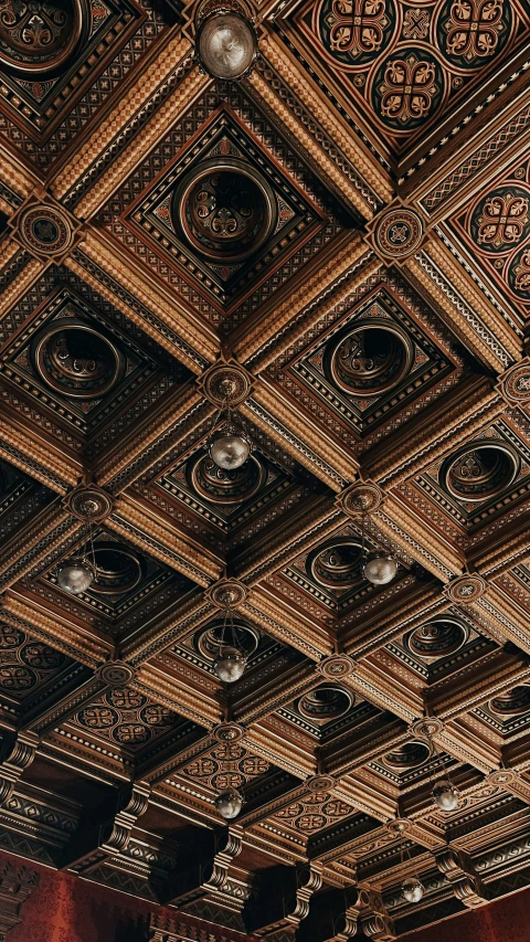an elaborate wooden ceiling with many light fixtures
