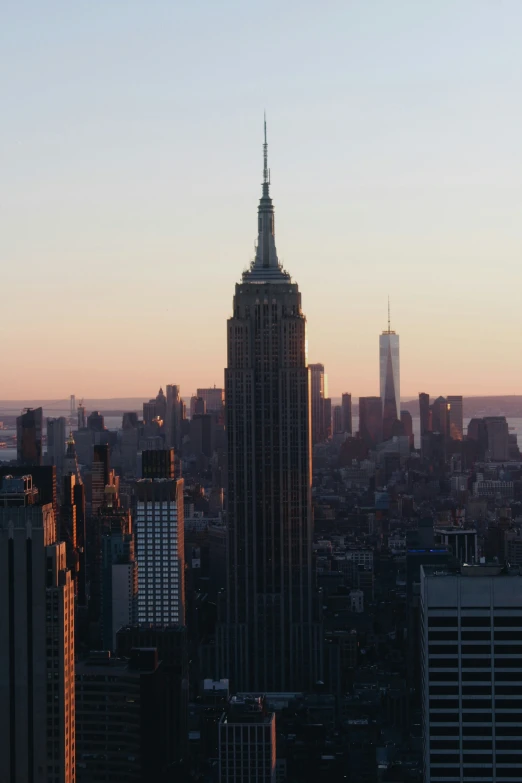 view of skyscrs at sunset with a bird eye lens view