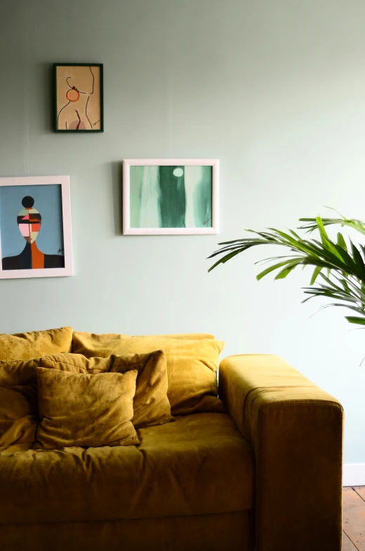 a living room with pictures on the wall