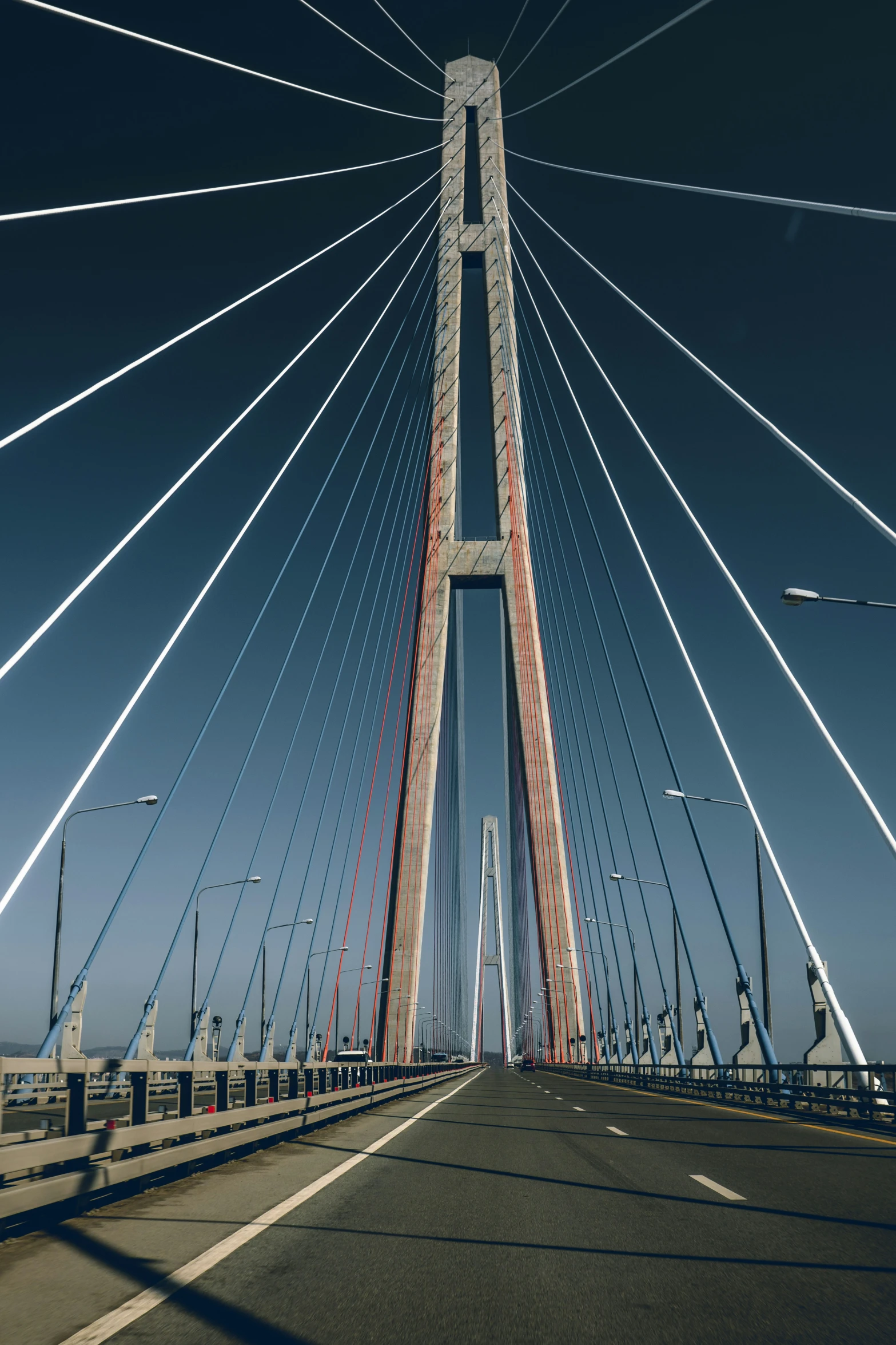 the view from the car driving over a very large bridge