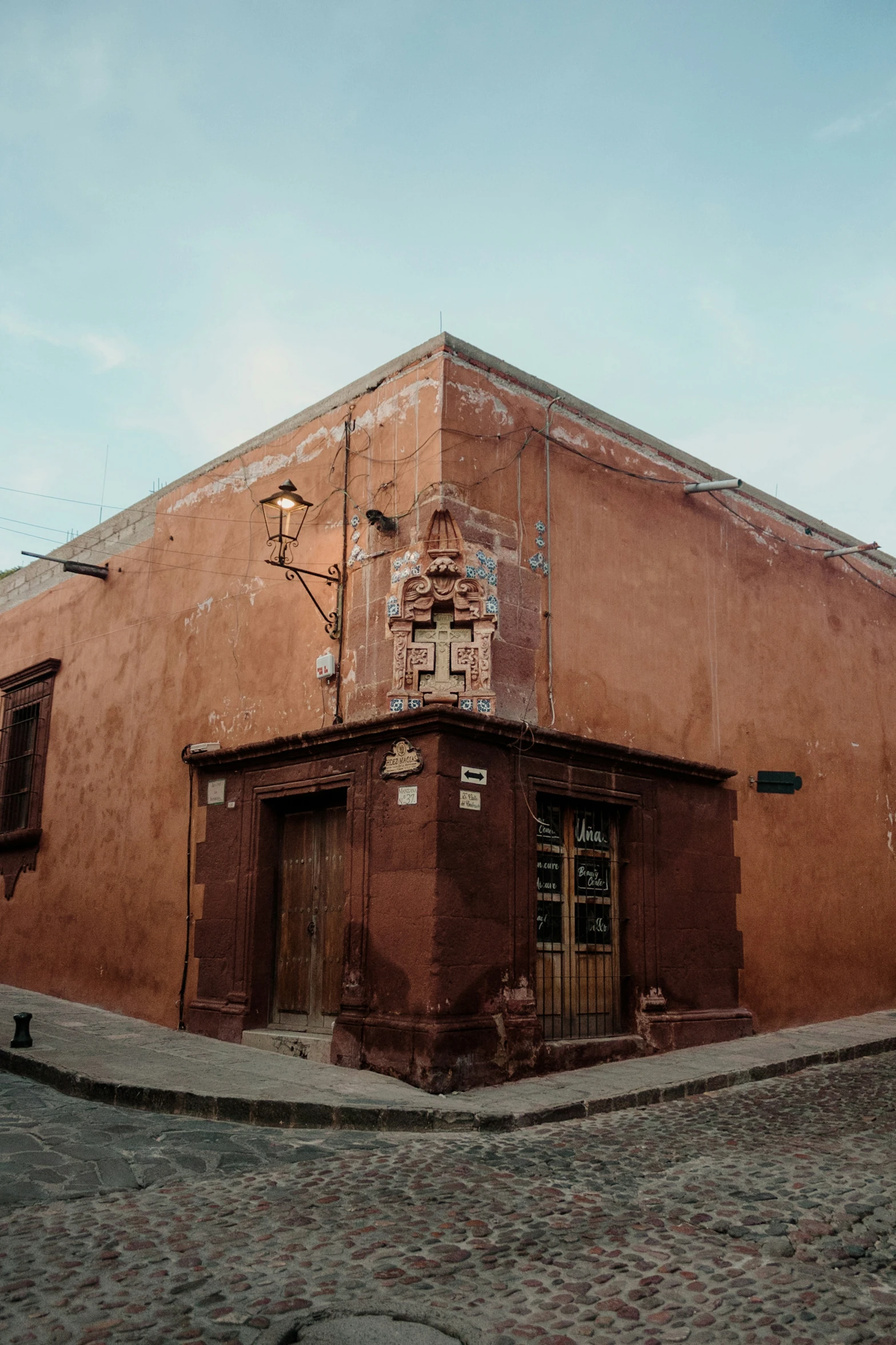 a very old brick building sitting on the corner