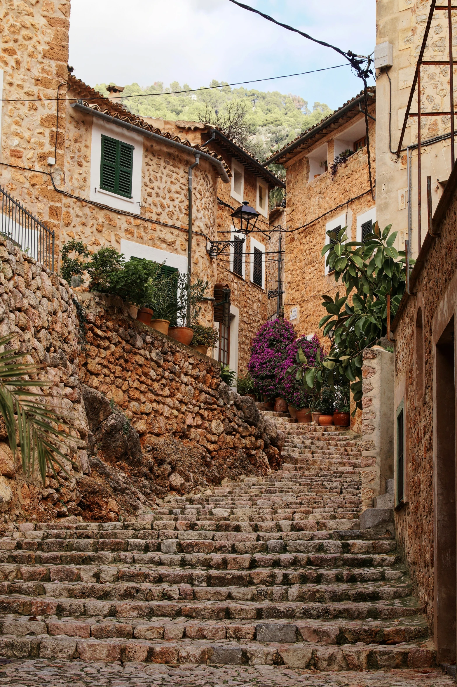 a set of stairs that lead up to several buildings