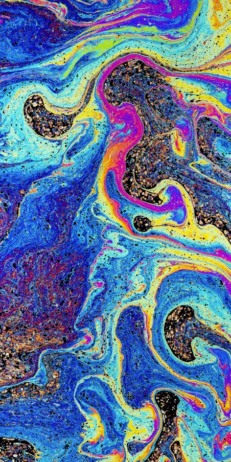 the colorful water is swirled across the surface