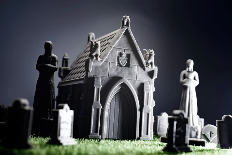 a miniature model of a cemetery has statues