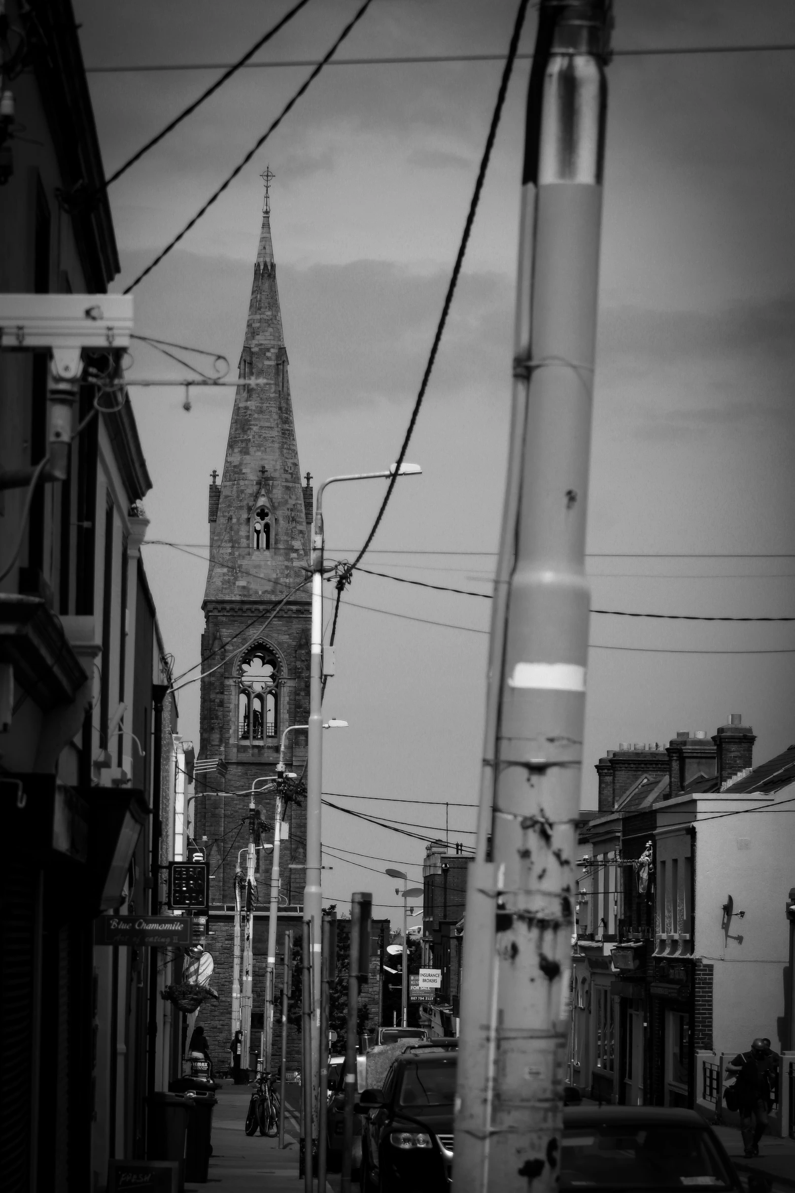 a tall tower with a clock on it is in the middle of a city