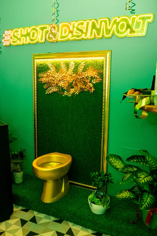 a yellow toilet next to a green wall