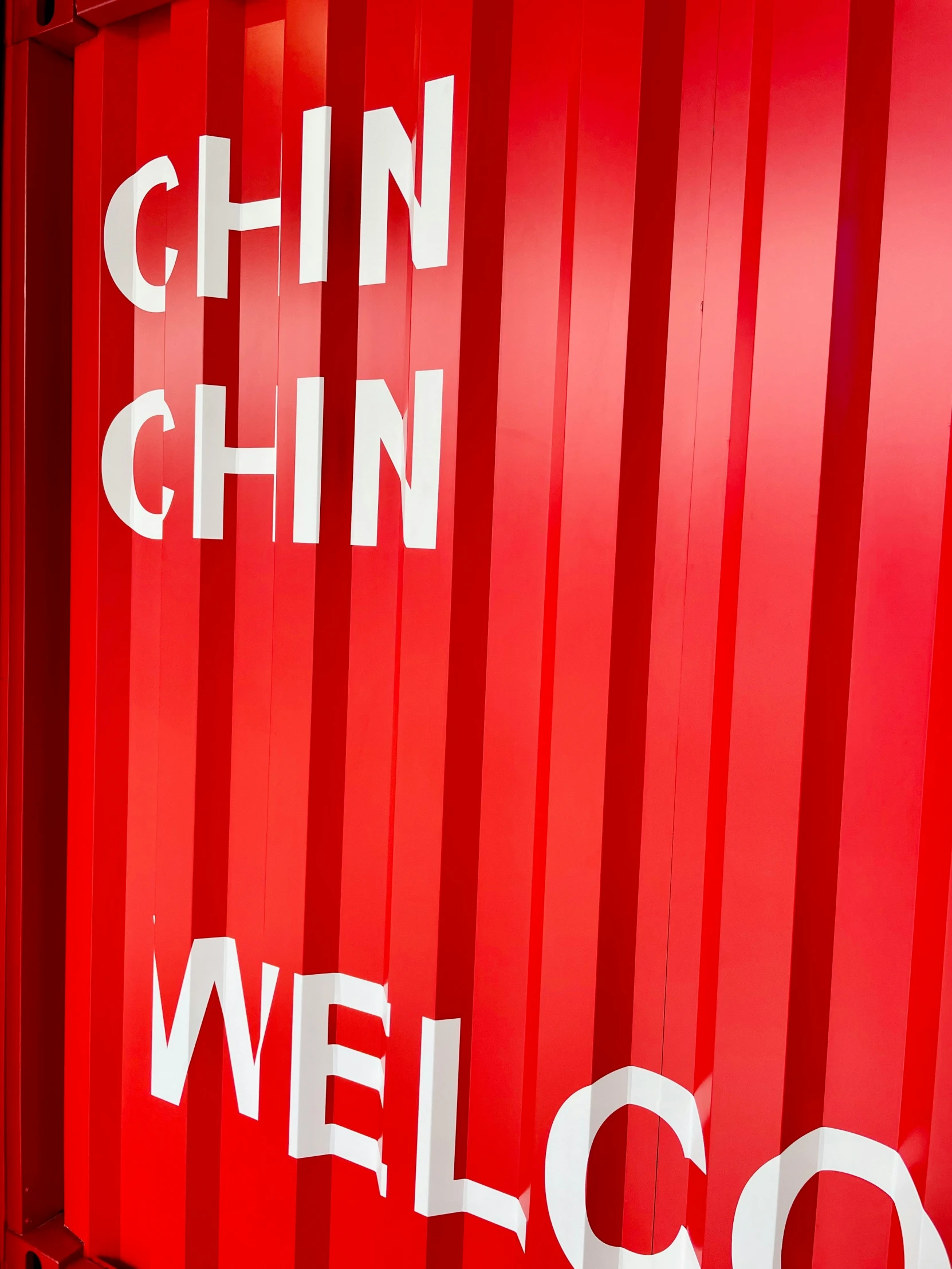 a red box with white lettering stating welcome