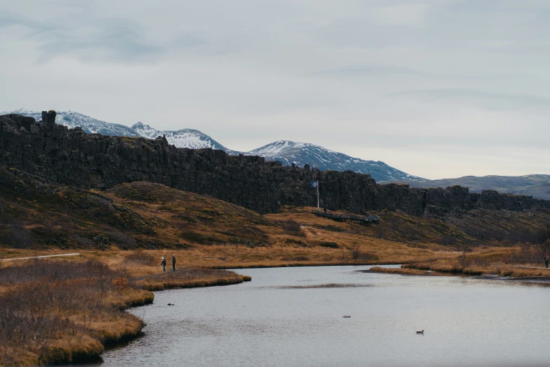 the body of water in front of mountains with no people