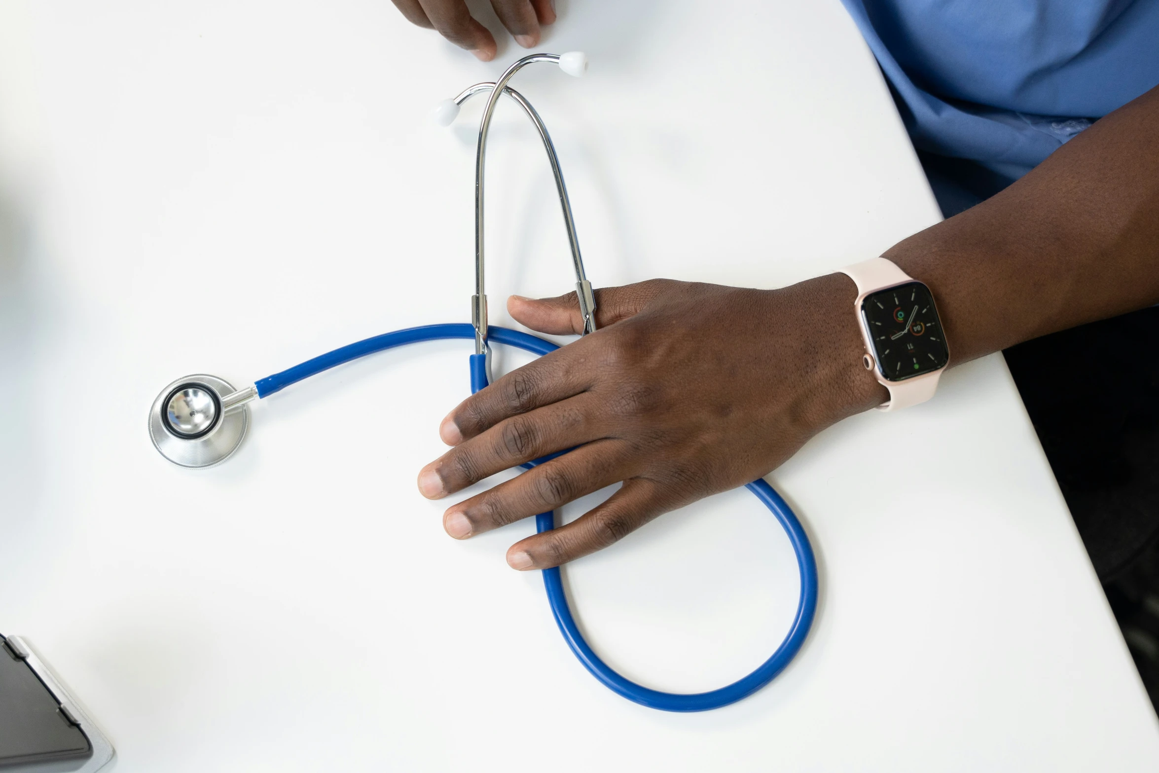 a hand that is holding onto a medical tube