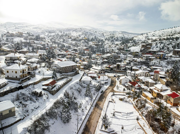 a view of a small town covered in snow