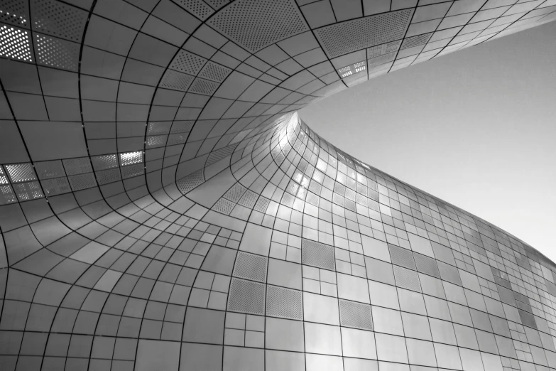 the top of a building with a large sky background