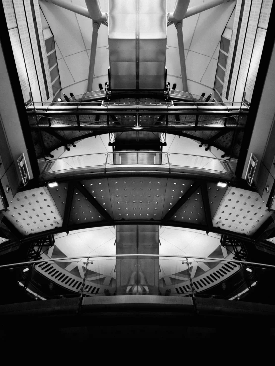 black and white po of a large building with people standing at the top