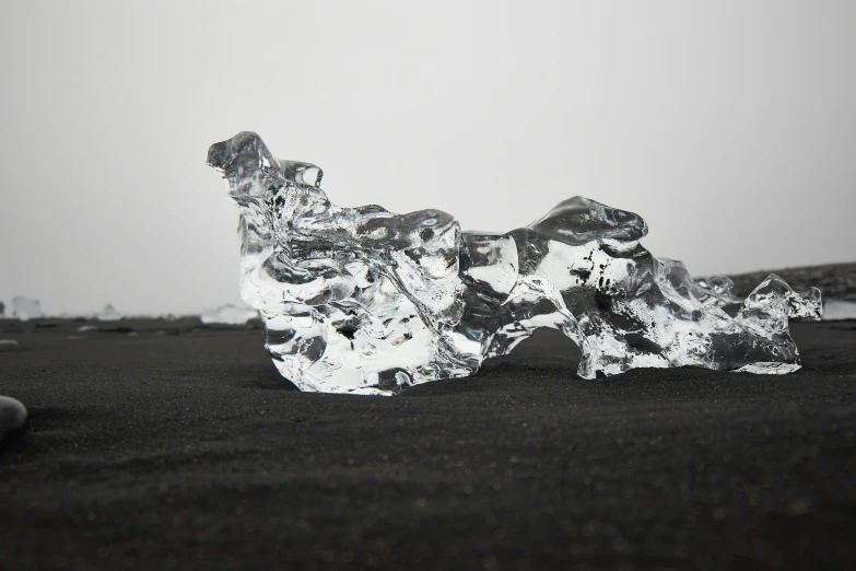 a piece of ice and a person's feet in the background