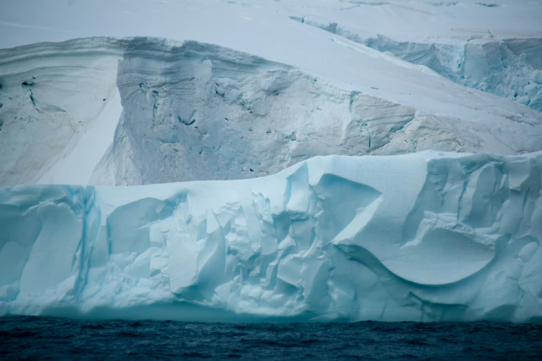 a large iceberg towering into the air