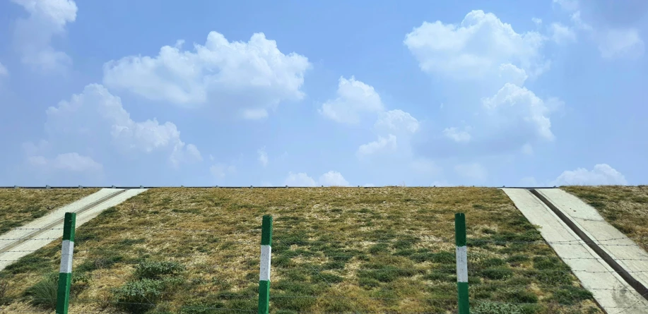 two road crosses sitting in a field with grass