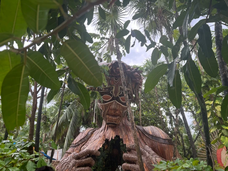 an elaborate looking tree with a large snake like structure in the middle